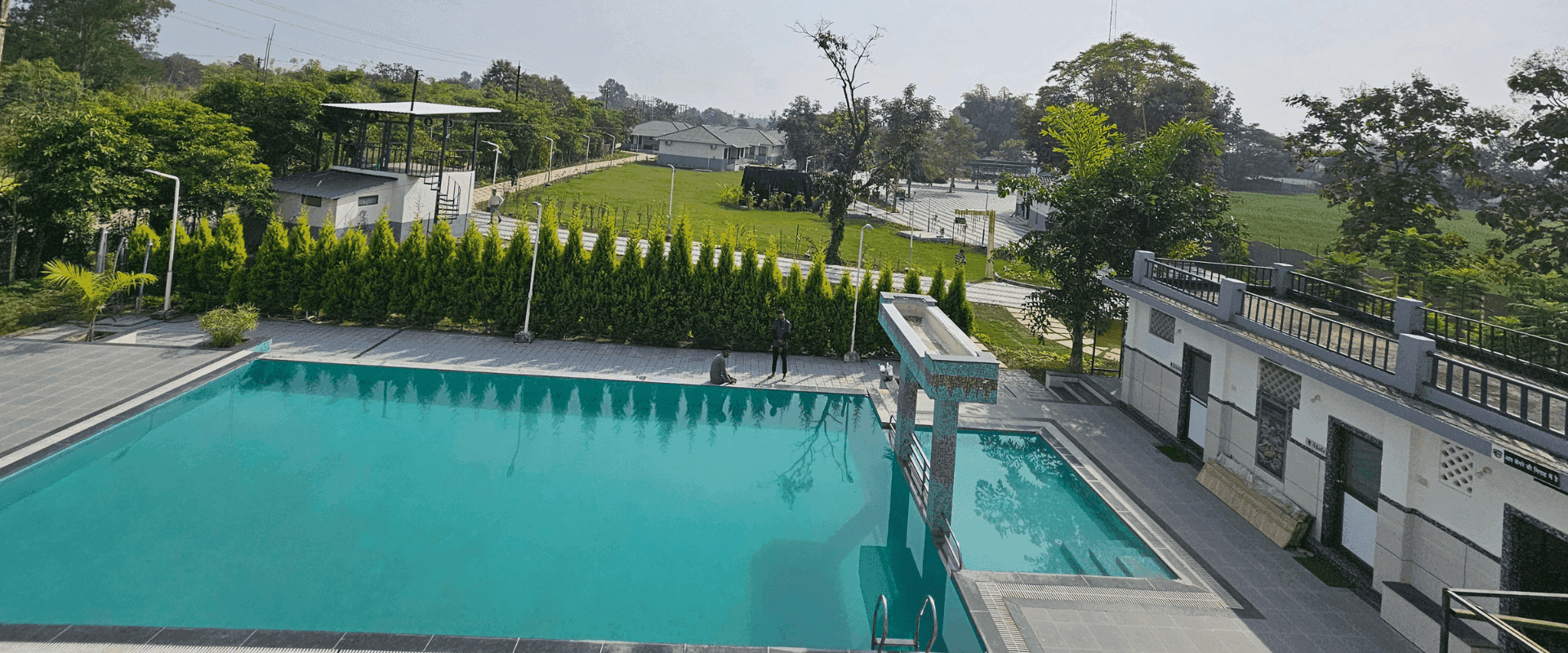 Swimming pool with large party deck at Choice Resort Bhopal on Kolar Road