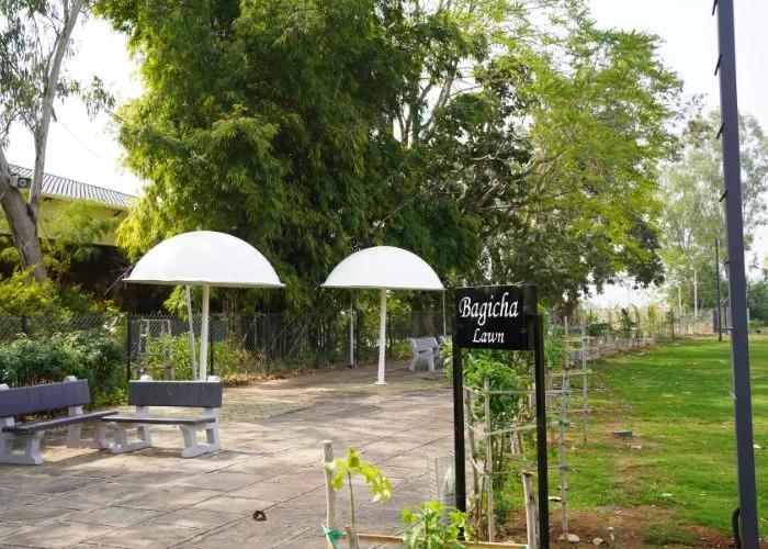 Garden seating area at Choice Resort Bhopal surrounded by nature